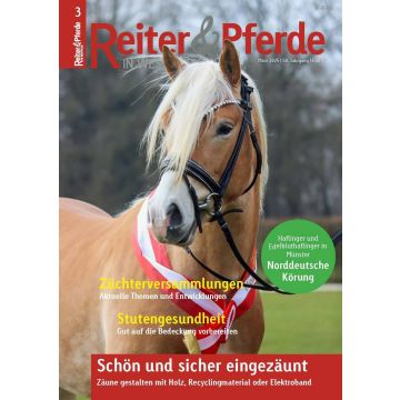 Auf dem Bild ist das Cover einer Zeitschrift mit dem Titel "Reiter & Pferde in Westfalen" zu sehen. Es zeigt einen Haflinger mit einer rot-weißen Schärpe um den Hals. Der Hintergrund ist unscharf, vermutlich im Freien. Die Schlagzeilen auf dem Cover behan